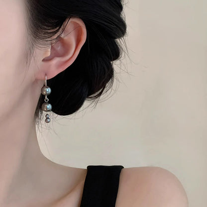 Klassinen Helmi Korvarengas ajattomalla viehätyksellä