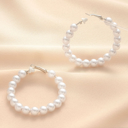 Klassinen Helmi Korvarengas ajattomalla viehätyksellä