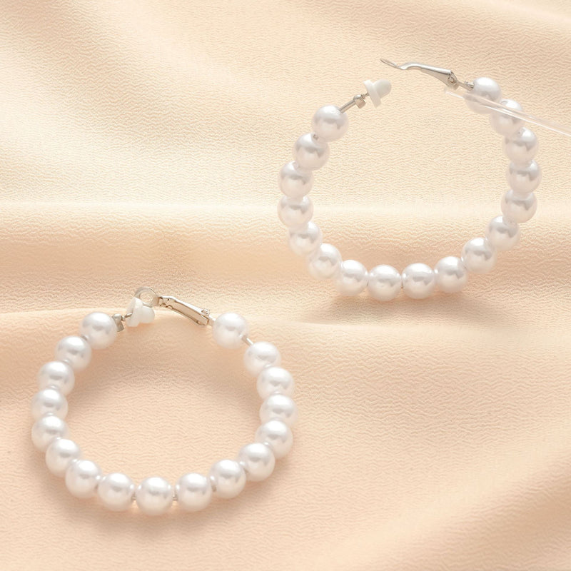 Klassinen Helmi Korvarengas ajattomalla viehätyksellä